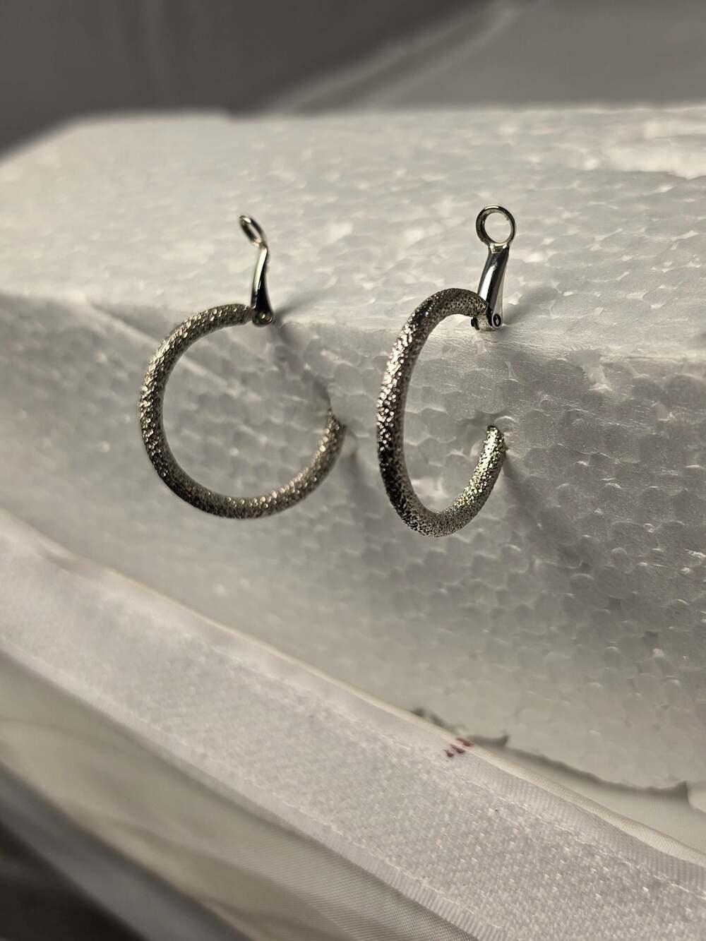 Silver toned Stardust Textured Round Hoop Earrings